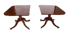 A Regency Double Pillar Two Part Mahogany Tilt Top Dining Table