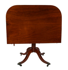 A Regency Double Pillar Two Part Mahogany Tilt Top Dining Table