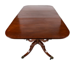 A Regency Double Pillar Two Part Mahogany Tilt Top Dining Table