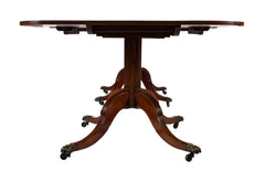 A Regency Double Pillar Two Part Mahogany Tilt Top Dining Table