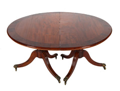 A George III Two Part Tilting Demi Lune Section Mahogany Dining Table