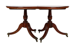 A George III Two Part Tilting Demi Lune Section Mahogany Dining Table