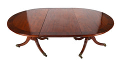 A George III Two Part Tilting Demi Lune Section Mahogany Dining Table