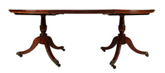 A George III Two Part Tilting Demi Lune Section Mahogany Dining Table