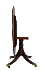 A Regency Mahogany Satinwood Banded Tilt Top Center Table