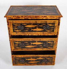 A Bamboo Three Drawer Bureau with Decoupaged Fish Prints