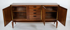 A Mid-Century Gio Ponti Walnut Three Door "Floating" Cabinet