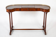 An English Regency Kidney Shaped Mahogany Desk