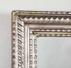 A Louis Philippe Carved and Silver Gilt Wood Framed Mirror