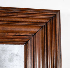 A 19th Century French Patinated Oak Framed Mirror