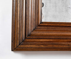 A 19th Century French Patinated Oak Framed Mirror