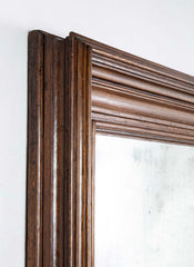 A 19th Century French Patinated Oak Framed Mirror