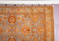 A Spanish Wool Carpet Having Floral Motifs