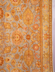 A Spanish Wool Carpet Having Floral Motifs