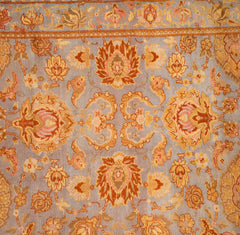 A Spanish Wool Carpet Having Floral Motifs