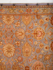 A Spanish Wool Carpet Having Floral Motifs