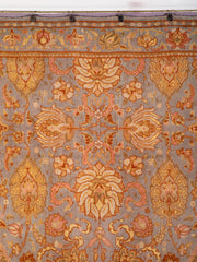 A Spanish Wool Carpet Having Floral Motifs