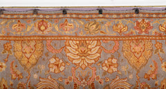 A Spanish Wool Carpet Having Floral Motifs