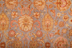 A Spanish Wool Carpet Having Floral Motifs