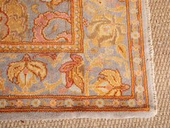 A Spanish Wool Carpet Having Floral Motifs