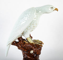 A Japanese White Glazed Porcelain Hawk Perched on a Tree Stump