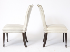 A Set of 12 Leather and Close Chrome Nailed Side Chairs