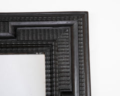 An Ebonized Dutch Baroque Style Mirror